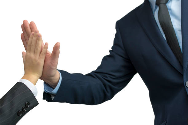 istock father and son in formal wear giving high five on white 898987396