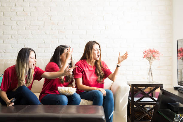 istock Sports fans rooting for their team 898987958