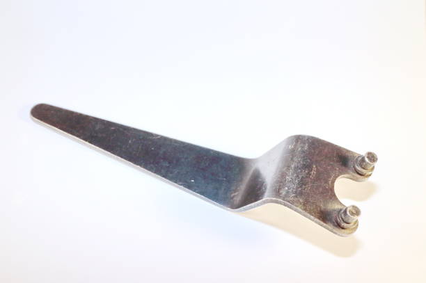 istock tool for work, special metal key with curved handle on a white background 898988436