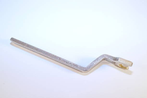istock tool for work, special metal key with curved handle on a white background 898988548