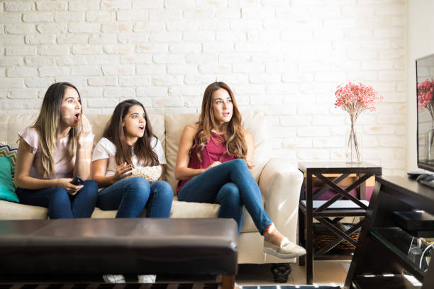 istock Looking surprised about a tv show 898988740