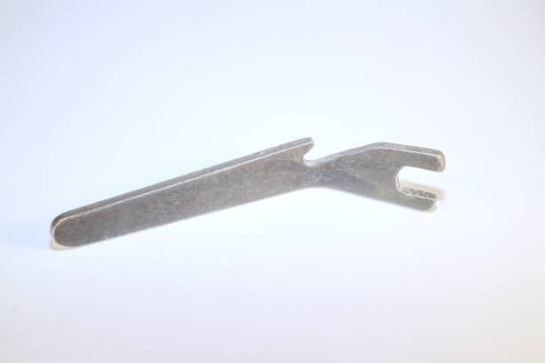istock tool for work, special metal key with curved handle on a white background 898988852