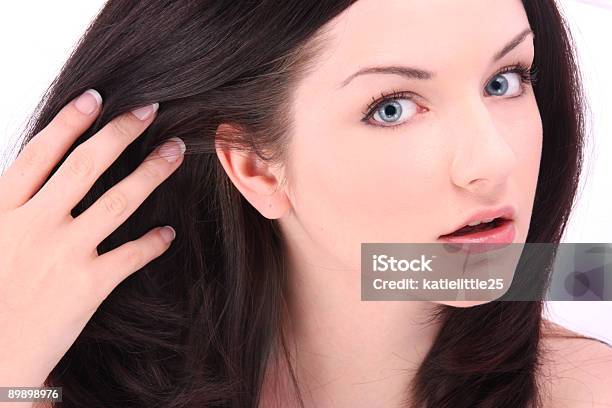 Beautiful Brunette Touching Hair On White Stock Photo - Download Image Now - Fingernail, 20-29 Years, Adult