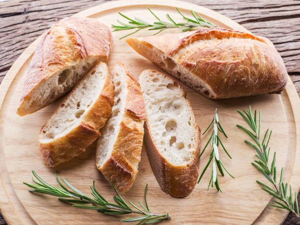 istock Slices of ciabatta with rosemary herb. 898994830