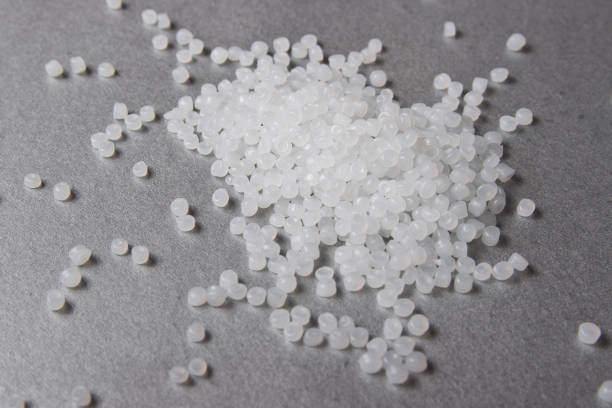 Polypropylene granules on the grey background. Polypropylene granules on the grey background. polyethylene terephthalate stock pictures, royalty-free photos & images