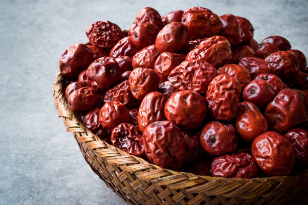 Red Jujube Fruits in Wooden Basket. Red Jujube Fruits in Wooden Basket. Organic Food. rose hip stock pictures, royalty-free photos & images