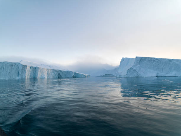 istock Oversized Icebergs on Arctic Ocean in Greenland 898999750