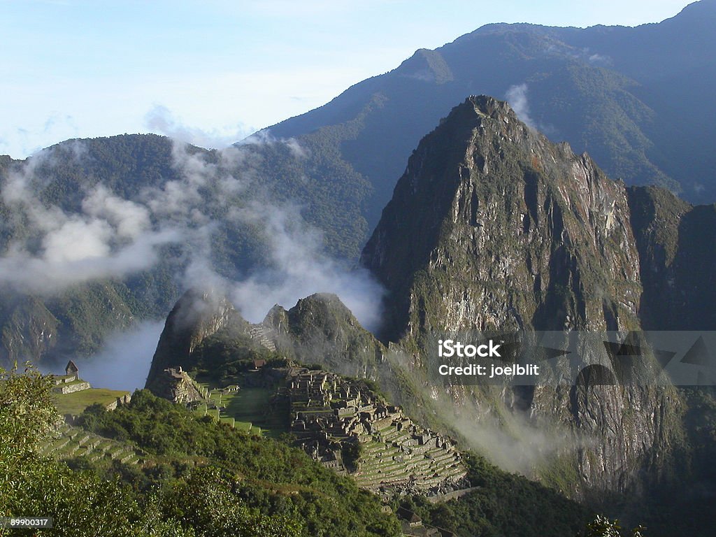 Machu Picchu in mist  Abandoned Stock Photo