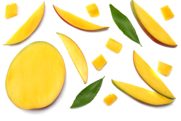 istock mango slice with green leaves isolated on white background. top view 899006664
