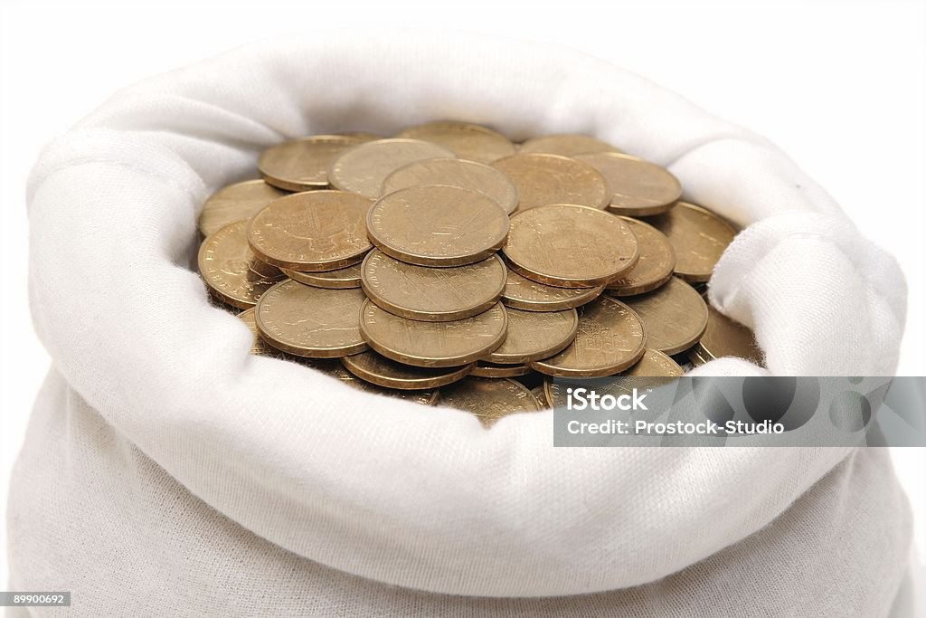 Monedas en una bolsa - Foto de stock de Actividades bancarias libre de derechos