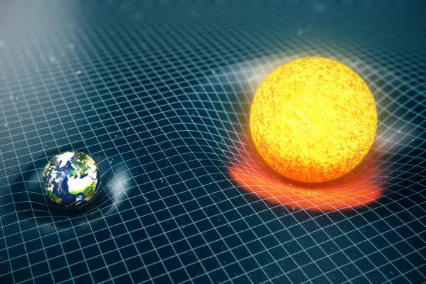 Photo of 3D illustration Earth's and Sun gravity bends space around it. With bokeh effect. Concept gravity deforms space time grid around universe. Spacetime curvature. Elements of this image furnished by NASA. https://commons.wikimedia.org/wiki/File:Land_ocean_ic