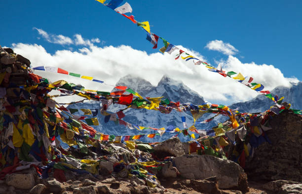 istock Tibetan buddhist prayer flags blowing in the wind. 899016062