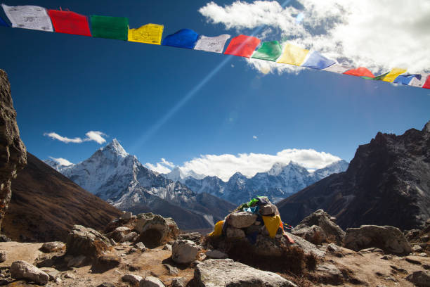 istock Tibetan buddhist prayer flags blowing in the wind. 899016082