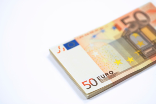 Close-up photograph of a ten euro bill with the word EURO.