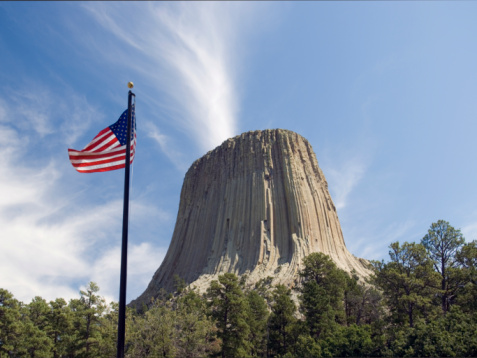 An American flag flying in the wind at Devils Tower National Monument