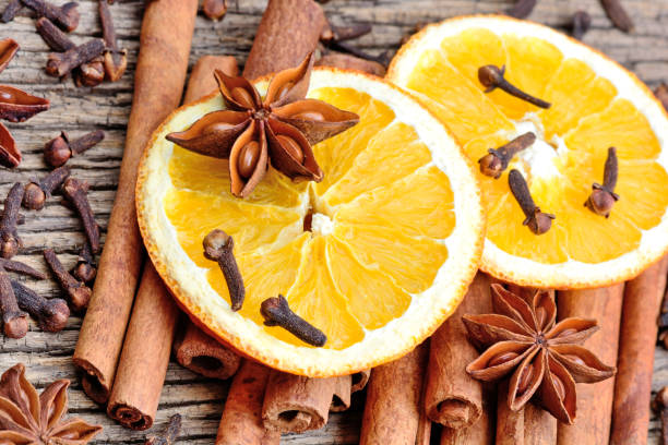 istock Different spices with sliced of dried orange on table 899028712