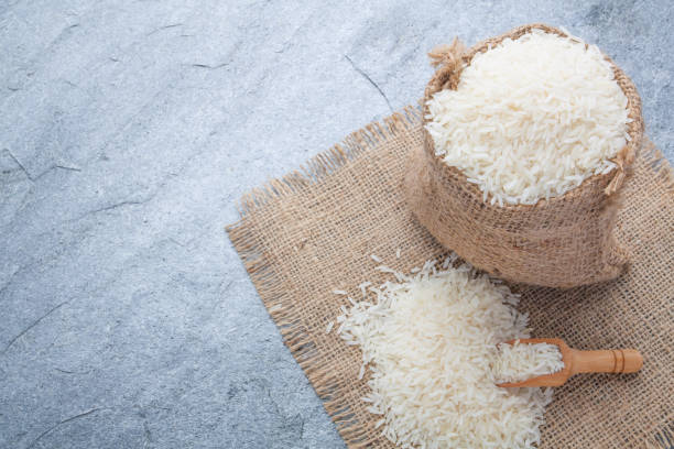 istock thai fragrant jasmine rice in a spoon with gold spike on sack 899031512