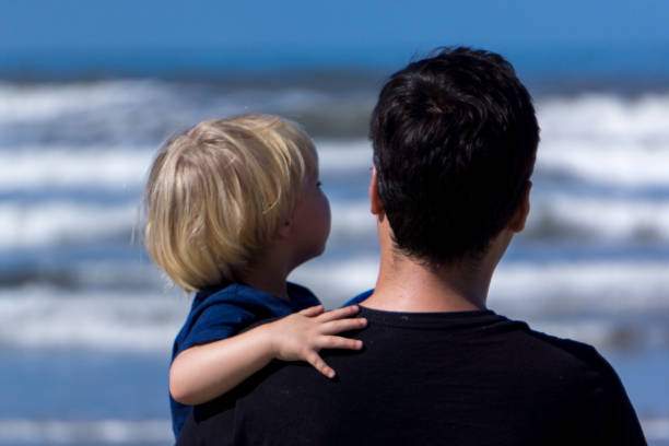 istock dad and sun at the beach 899040232