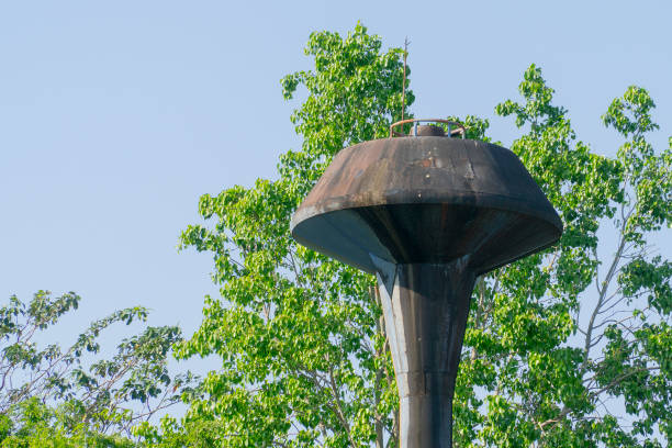istock water tank and old with green tree background and blue sky 899040564
