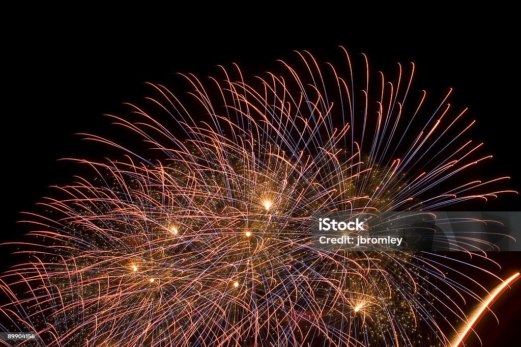 Multiple Fireworks bursts on a night sky.  Awe Stock Photo