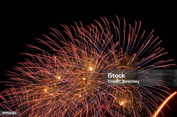 Multiple Fireworks Bursts On A Night Sky Stock Photo - Download Image Now - Awe, Black Color, Blue