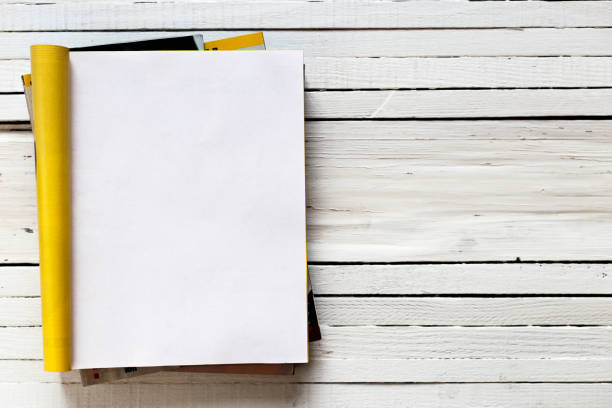 Magazine page mock up catalog opened on a white wooden background. Top view. Copy space