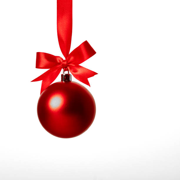 istock Red christmas ball with red bow over white 899056858