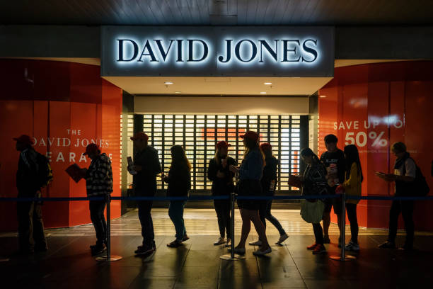 Melbourne, Australia - December 26, 2017: A long line of shoppers queue up outside David Jones in the early hours of Boxing Day. The upmarket department store has traditionally opened its doors early on the day an offered discounts on many items.
