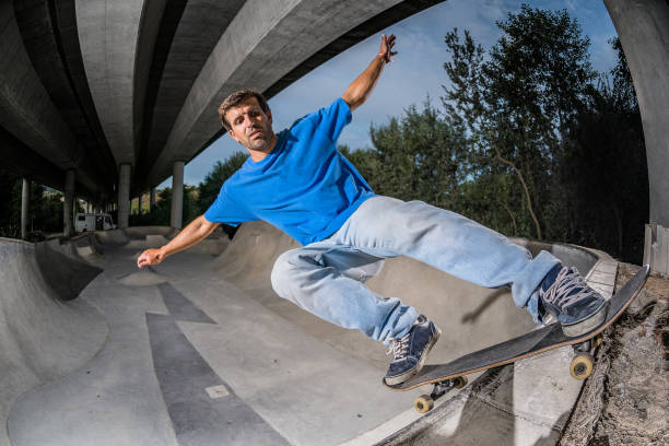 istock Skateboarder in a concrete skatepark 899060982