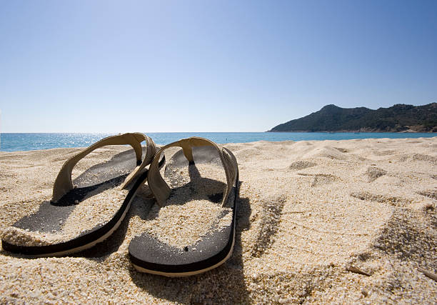 Sandals on the beach stock photo