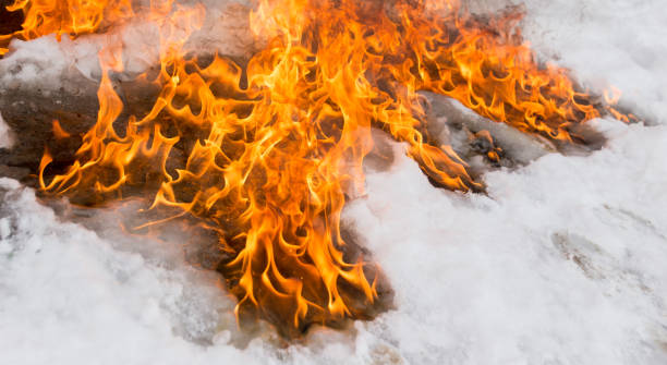 Medium shot of a girl crying while being surrounded by flames