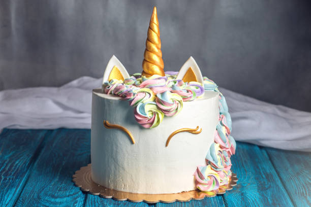 Beautiful bright cake decorated in the form of fantasy unicorn. Concept of a festive dessert for kids birthday stock photo