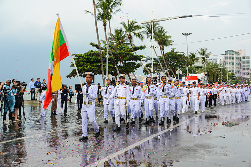 Putrajaya, Malaysia - August 31, 2023: An image classic uniform fire fighter marching with vehicle . Celebrating the 66th anniversary of Independence Day or Merdeka Day.