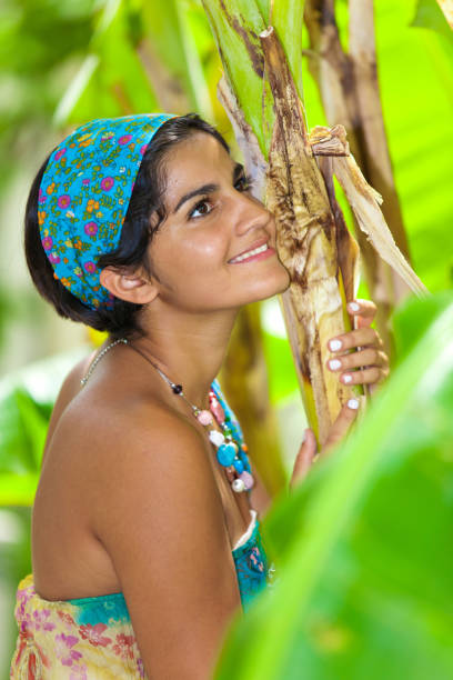 istock Happy girl between palm leaves 899082750
