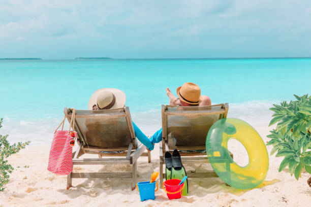 istock happy couple relax on a tropical beach 899083730