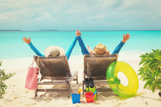 istock happy couple relax on a tropical beach 899083770