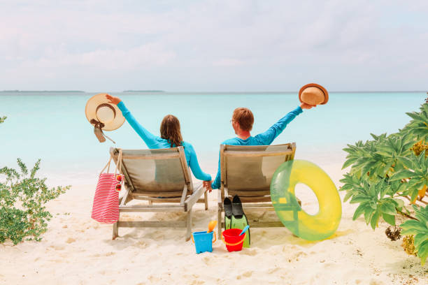 istock happy couple relax on a tropical beach 899083794