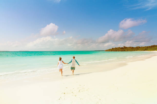 istock happy loving couple enjoy tropical beach 899083874