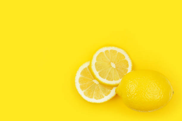 istock background of heap fresh yellow lemon slices. Seamless pattern for your design. Close-up. Studio photography. 899086212