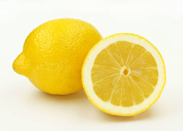 istock Lemon. Fresh lemon isolated on white. Lemon in a cut 899086218