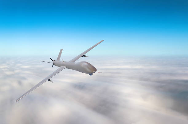 istock Unmanned military aircraft fly high speed background blue sky clouds. 899090216