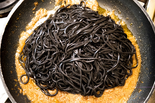 black pasta squid ink pan up view italian taglierini al nero di seppia