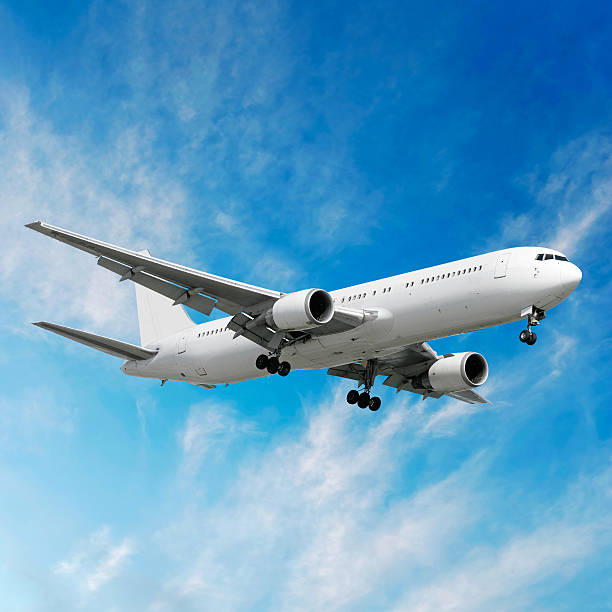 istock jet airplane landing in bright sky 89909548