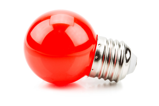 Red light sphere bulb isolated on white background