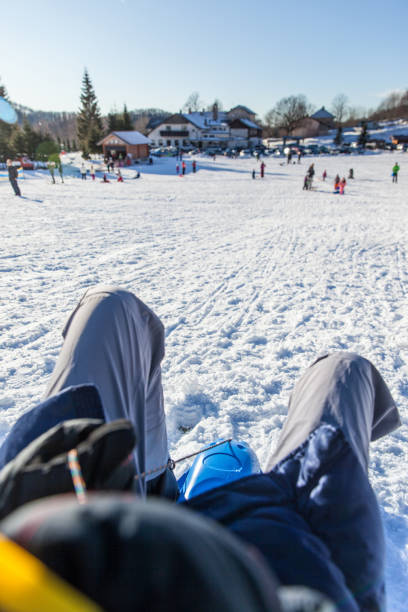 istock Joyful Woman Ride Sledge Down Hill 899096394