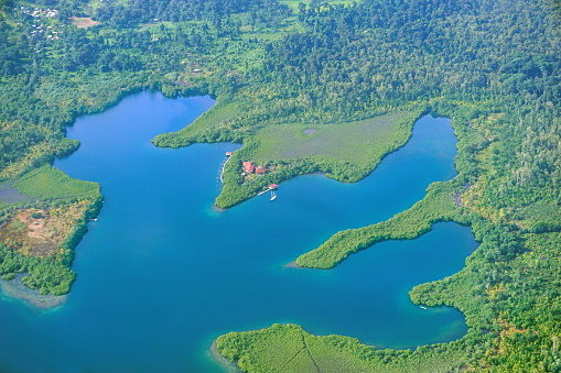 Aerial view of a lagoon with a small resort in construction in the archipelago of Bocas del Toro, Cristobal island, Panama, Central America