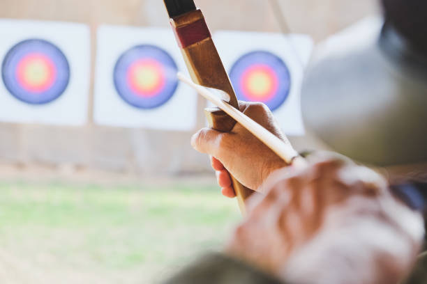 istock Archer holds his bow aiming at a target 899099920