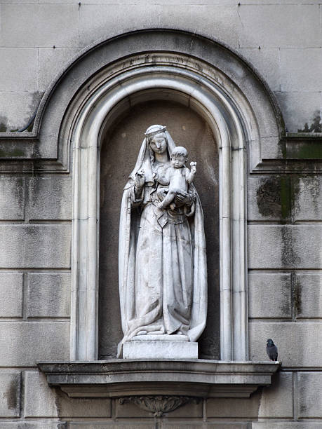 Madonna holding the infant Jesus - sculpture in Barcelona.