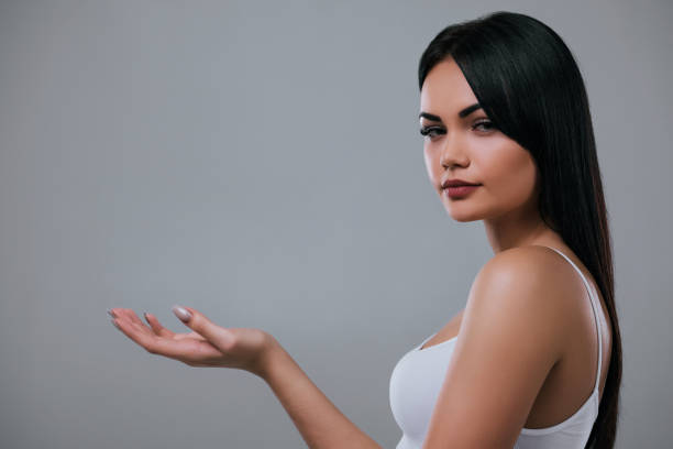 istock Beautiful woman on grey background. 899104266