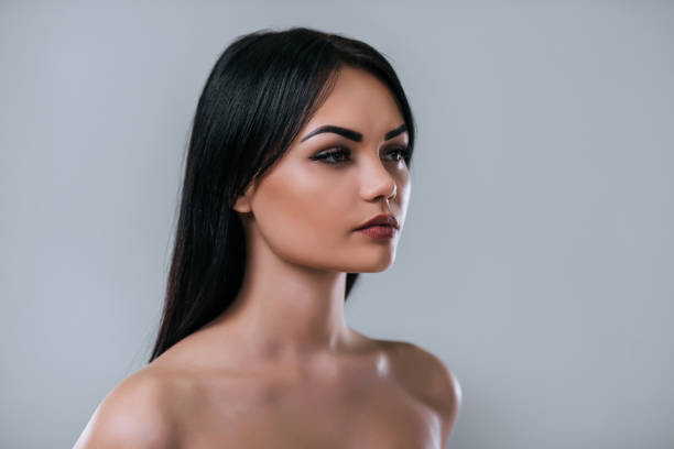 istock Beautiful woman on grey background. 899104540